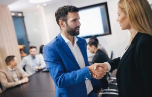 Business people shaking hands in modern office